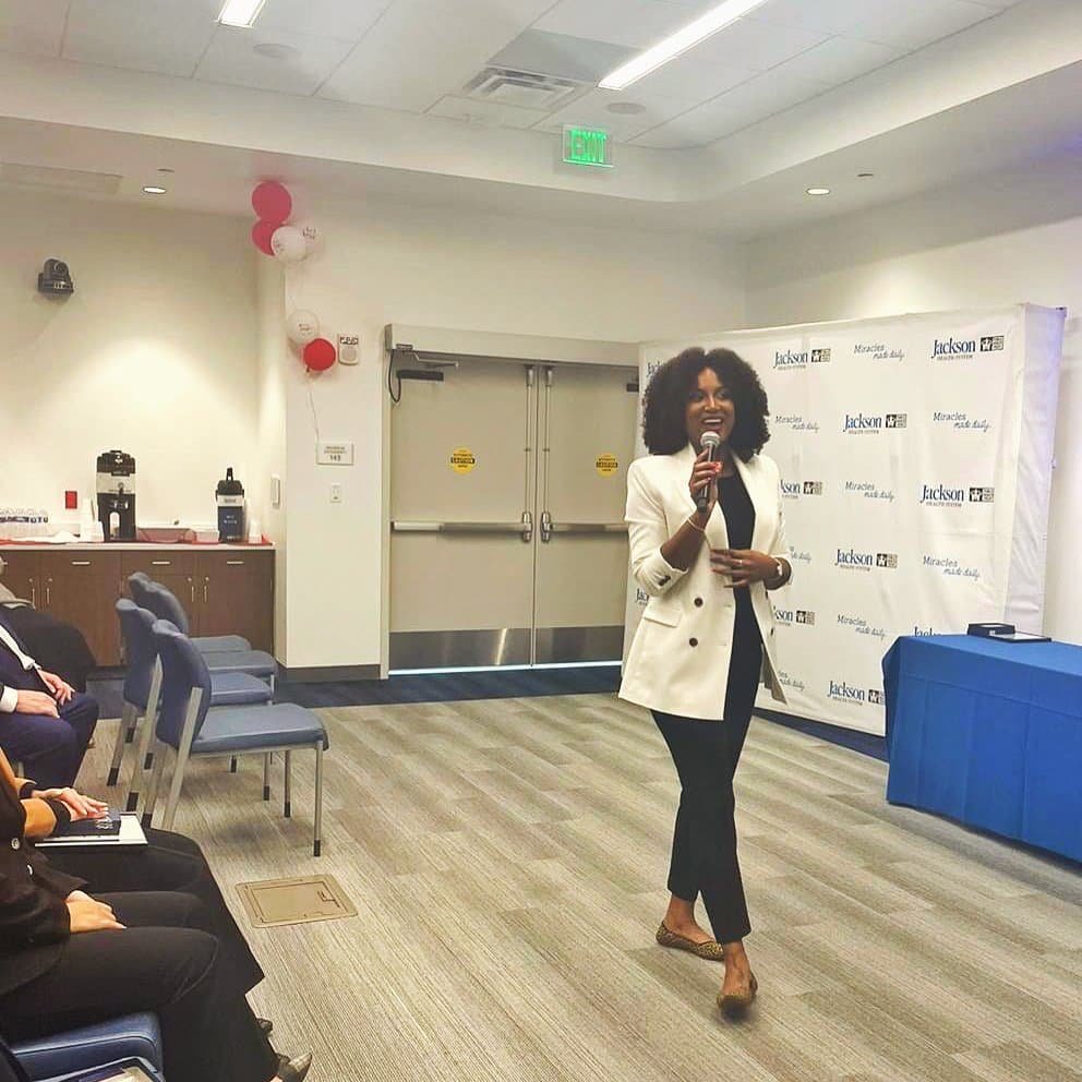 Stephanie speaking at Jackson Health